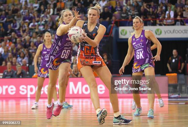 Kimberley Jenner of the Firebirds and Joanne Harten of the Giants compete during the round 11 Super Netball match between the Firebirds and the...