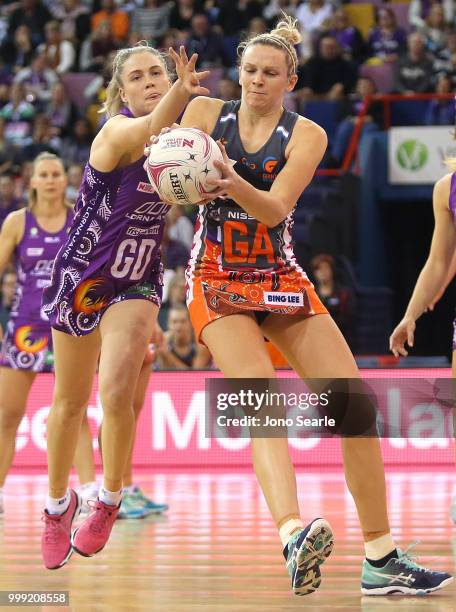 Kimberley Jenner of the Firebirds and Joanne Harten of the Giants compete during the round 11 Super Netball match between the Firebirds and the...