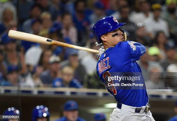 Javier Baez of the Chicago Cubs hits a three-run home run during the ninth inning of a baseball game against the San Diego Padres at PETCO Park on...