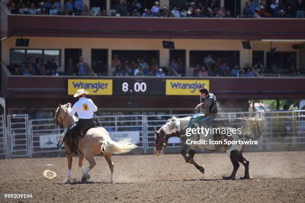 Chance Ames of Big Piney, WY, stays on for eight seconds at the Calgary Stampede on July 14, 2018 at Stampede Park in Calgary, AB.