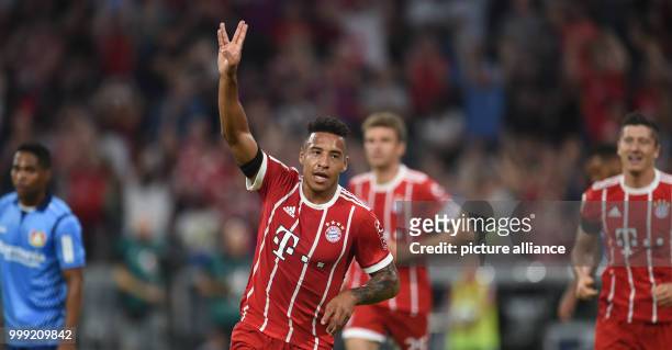 Muenchen's Corentin Tolisso celebrates his 2-0 goal during the German Bundesliga soccer match between Bayern Muenchen and Bayer Leverkusen in the...