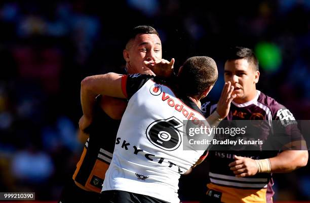 Jaydn Su'a of the Broncos takes on the defence during the round 18 NRL match between the Brisbane Broncos and the New Zealand Warriors at Suncorp...