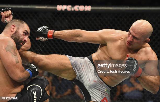 Junior Dos Santos of Brazil kicks Blagoy Ivanov in their heavyweight fight during the UFC Fight Night event inside CenturyLink Arena on July 14, 2018...