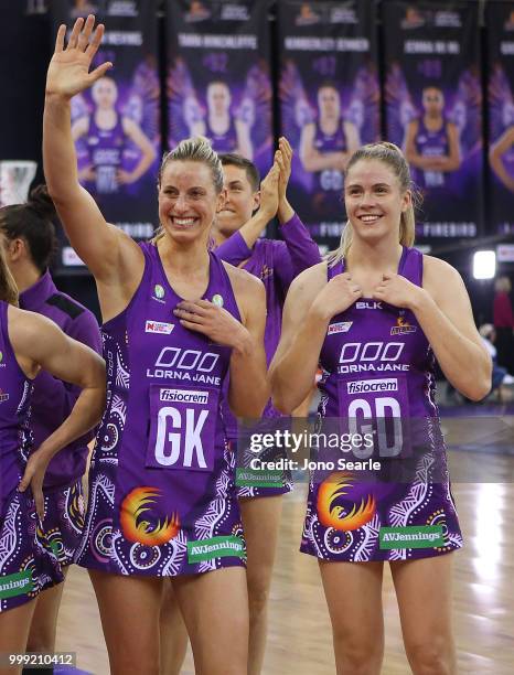 Laura Geitz of the Firebirds and Kimberley Jenner thank the crowd after the win during the round 11 Super Netball match between the Firebirds and the...