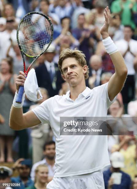 Kevin Anderson of South Africa acknowledges the crowd after winning 7-6, 6-7, 6-7, 6-4, 26-24 against John Isner of the United States in a Wimbledon...