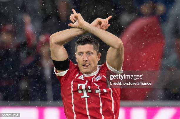 Muenchen's Robert Lewandowski celebrates his 3-0 goal during the German Bundesliga soccer match between Bayern Muenchen and Bayer Leverkusen in the...