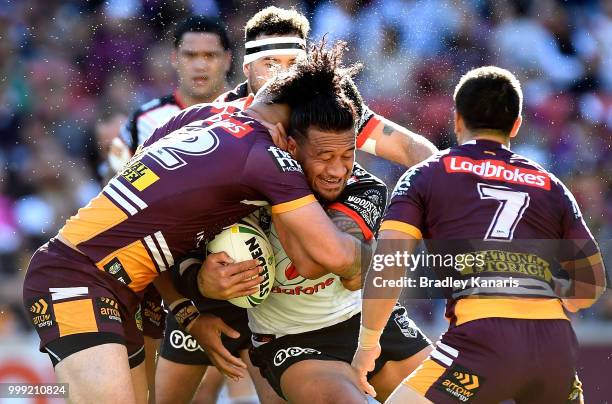 James Gavet of the Warriors takes on the defence takes on the defence during the round 18 NRL match between the Brisbane Broncos and the New Zealand...