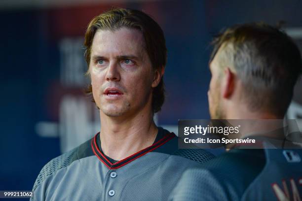 Arizona starting pitcher Zack Greinke talks things over with catcher Jeff Mathis in the dugout during the game between Atlanta and Arizona on July...