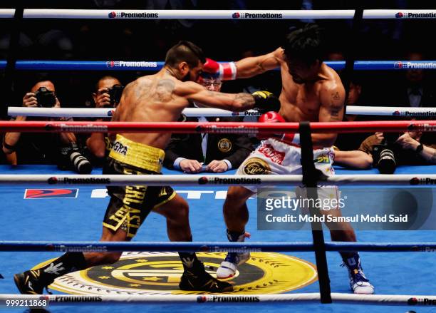 Argentina's Lucas Matthysse fight with Philippine's Manny Pacquiao during their World welterweight boxing championship title bout in Kuala Lumpur,...