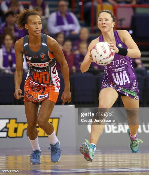 Caitlyn Nevins of the Firebirds looks to get past Serena Guthrie of the Giants during the round 11 Super Netball match between the Firebirds and the...