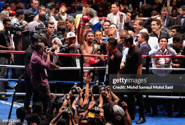 Philippine's Manny Pacquiao celebrated after winning fight with Argentina's Lucas Matthysse during their World welterweight boxing championship title...