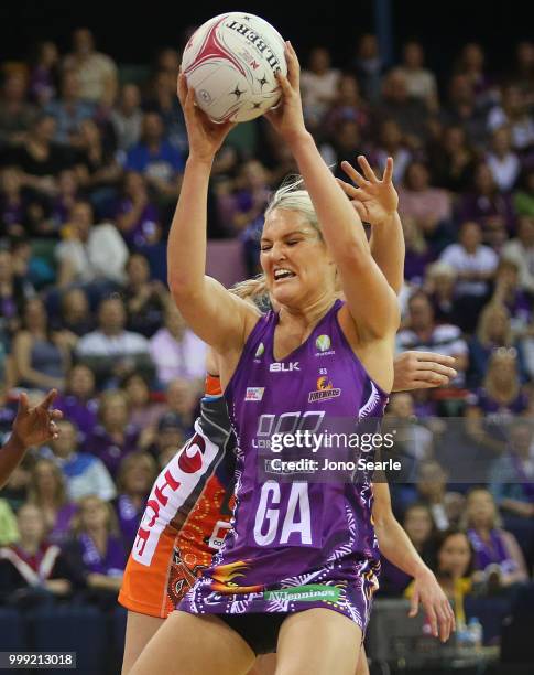 Gretel Tippett of the Firebirds secures the ball during the round 11 Super Netball match between the Firebirds and the Giants at Brisbane...