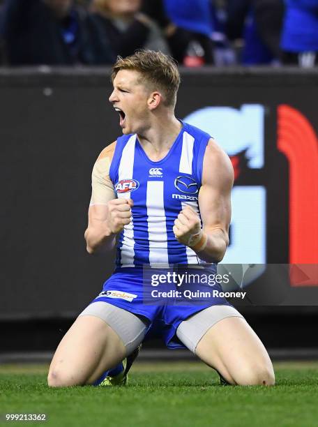 Jack Ziebell of the Kangaroos celebrates kicking a goal during the round 17 AFL match between the North Melbourne Kangaroos and the Sydney Swans at...