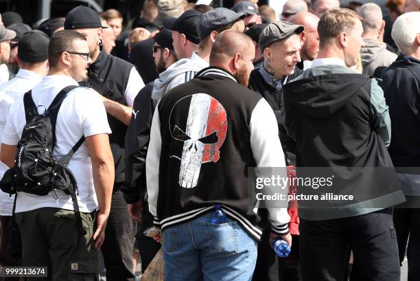 Right-wing extremists walk across the street to commemorate the 30th anniversary of the death of Hitler's deputy Rudolf Hess at the Spandau train...