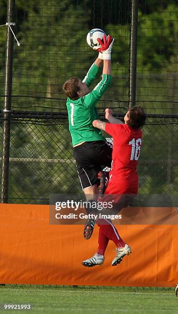 Goalkeeper Franco Flückiger of Germany battles for the ball with Mateusz Mozdzen of Poland during the Uefa Under 19 Championship Elite Round between...