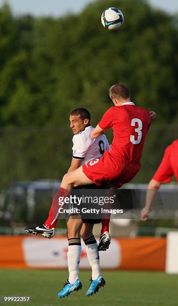 Cenk Tosun of Germany battles for the ball with Michael Czekaj of Poland during the U19 Championship Elite Round match between Germany and Poland at...