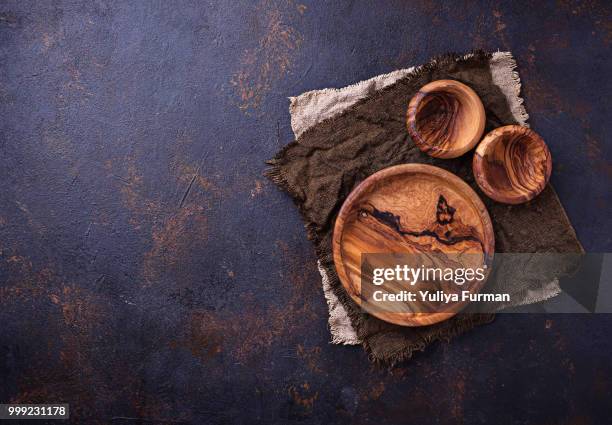 empty wooden plate and bowls on rusty background - cayenne powder stock pictures, royalty-free photos & images