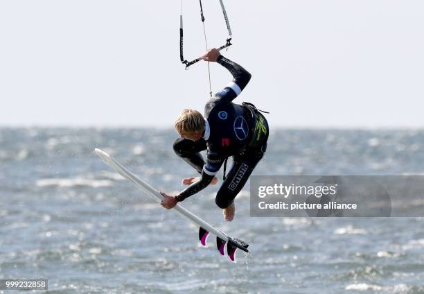 The German Kite-Surfer Felix Paul Schulz shows a jump in the 'Strapless Freestyle' competition during the Kitesurf World Cup at Fehmarn, Germany, 19...