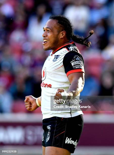 Agnatius Paasi of the Warriors celebrates scoring a try during the round 18 NRL match between the Brisbane Broncos and the New Zealand Warriors at...