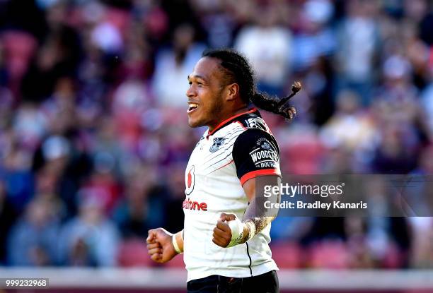 Agnatius Paasi of the Warriors celebrates scoring a try during the round 18 NRL match between the Brisbane Broncos and the New Zealand Warriors at...