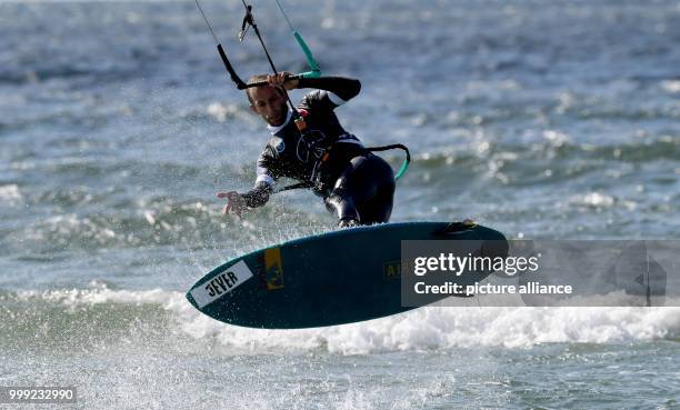 The Kite-Surfer Nicola Abadijiev of Bulgaria shows a jump in the 'Strapless Freestyle' competition during the Kitesurf World Cup at Fehmarn, Germany,...