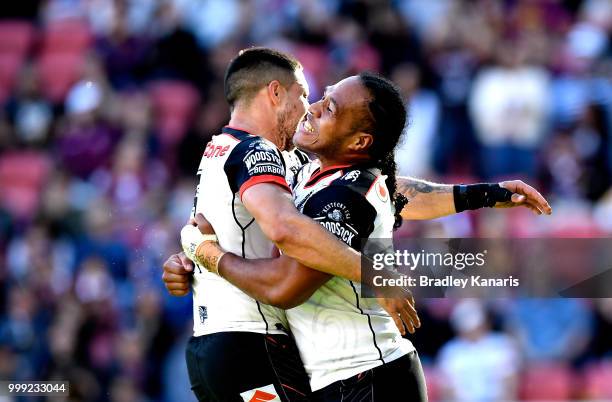 Agnatius Paasi of the Warriors celebrates scoring a try during the round 18 NRL match between the Brisbane Broncos and the New Zealand Warriors at...