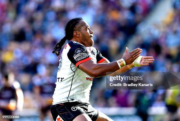 Agnatius Paasi of the Warriors celebrates scoring a try during the round 18 NRL match between the Brisbane Broncos and the New Zealand Warriors at...