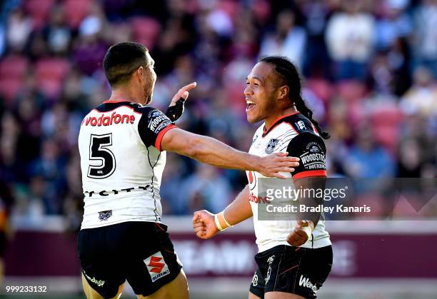Agnatius Paasi of the Warriors celebrates scoring a try during the round 18 NRL match between the Brisbane Broncos and the New Zealand Warriors at...