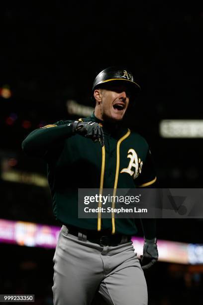 Mark Canha of the Oakland Athletics reacts after hitting a two-run home run during the seventh inning against the San Francisco Giants at AT&T Park...