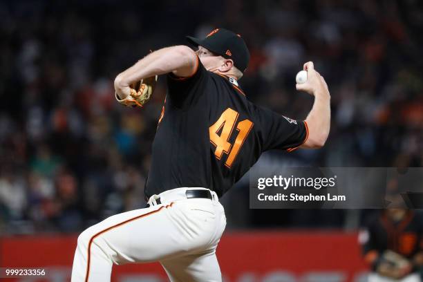 Mark Melancon of the San Francisco Giants delivers a pitch during the eighth inning against the Oakland Athletics at AT&T Park on July 14, 2018 in...