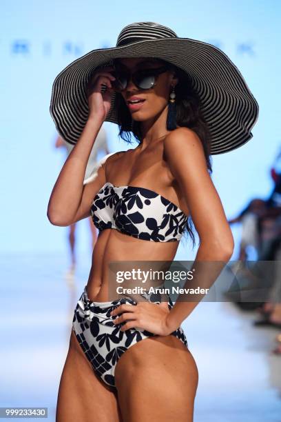 Model walks the runway for Trina Turk at Miami Swim Week powered by Art Hearts Fashion Swim/Resort 2018/19 at Faena Forum on July 14, 2018 in Miami...