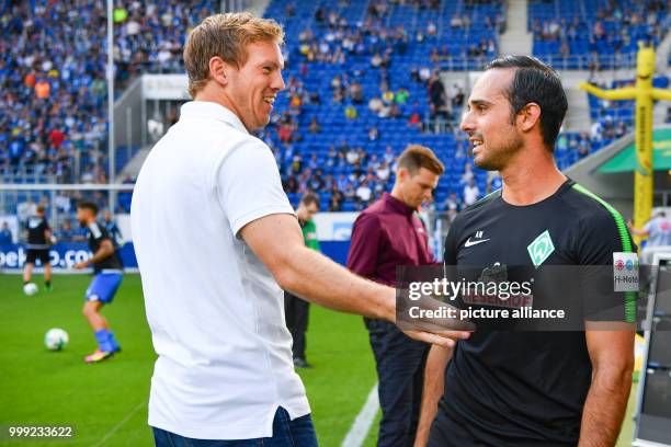 Hoffenheim's coach Julian Nagelsmann and Bremen's coach Alexander Nouri greet each other before the beginning of the German Bundesliga soccer match...