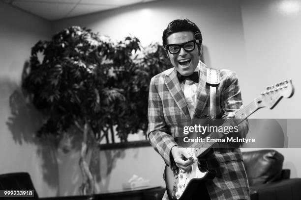 Elvis Presley impersonator Dean Z dressed as Buddy Holly attends the Las Vegas Elvis Festival at Sam's Town Hotel & Gambling Hall on July 14, 2018 in...