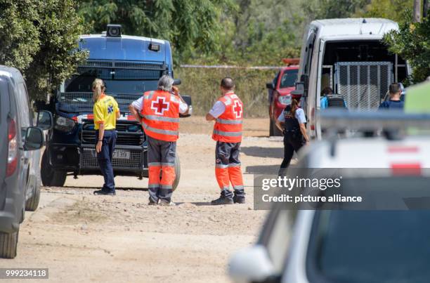 Paramedics and police officers work on a street where a residential house exploded on 16 August 2017 in Alcanar, Spain, 19 August 2017. The explosion...