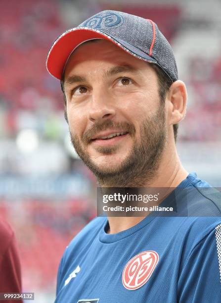 Mainz's coach Sandro Schwarz looks up at the German Bundesliga soccer match between FSV Mainz 05 and Hannover 96 in the Opel Arena in Mainz, Germany,...