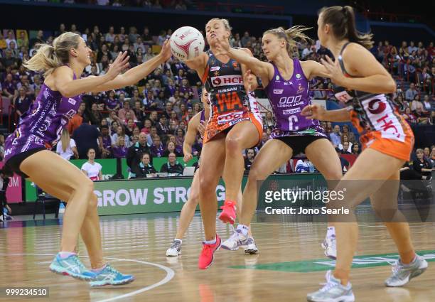 Laura Geitz of the Firebirds competes with Kimberlee Green of the Giants and Mahalia Cassidy of the Firebirds during the round 11 Super Netball match...