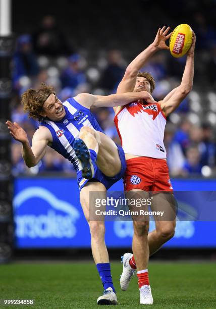 Dane Rampe of the Swans outmarks Ben Brown of the Kangaroos during the round 17 AFL match between the North Melbourne Kangaroos and the Sydney Swans...