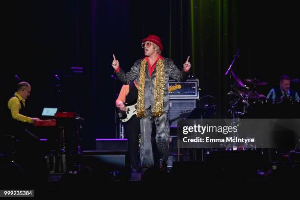 Elvis Presley impersonator Dwight Icenhower performs onstage as Elton John the Las Vegas Elvis Festival at Sam's Town Hotel & Gambling Hall on July...