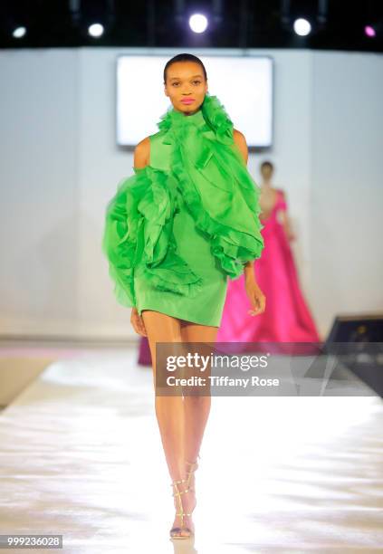 Model walks the runway at the HollyRod 20th Annual DesignCare at Cross Creek Farm on July 14, 2018 in Malibu, California.