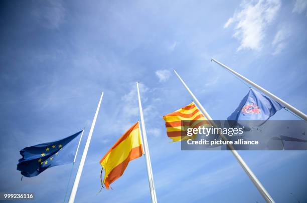 The flags of Europe , Spain, Catalonia and the municipality Cambrils are at half-mast in the yacht harbour of Cambrils, Spain, 19 August 2017. In the...