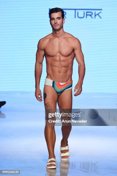 Model walks the runway for Trina Turk at Miami Swim Week powered by Art Hearts Fashion Swim/Resort 2018/19 at Faena Forum on July 14, 2018 in Miami...