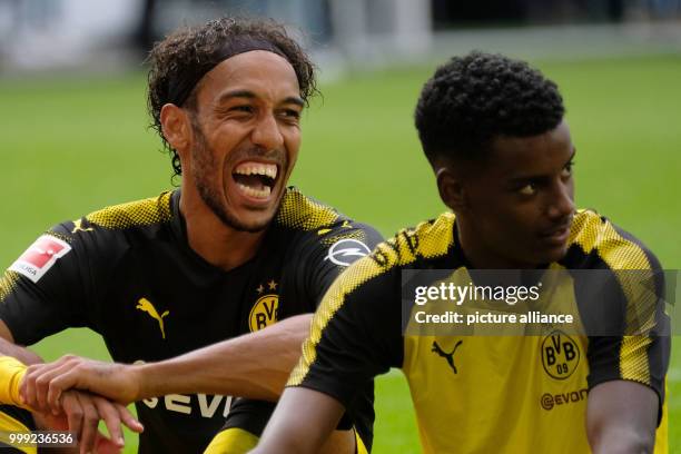 Dortmund's Pierre-Emerick Aubameyang and Alexander Isak sit on the pitch after the ending of the German Bundesliga soccer match between VfL Wolfsburg...