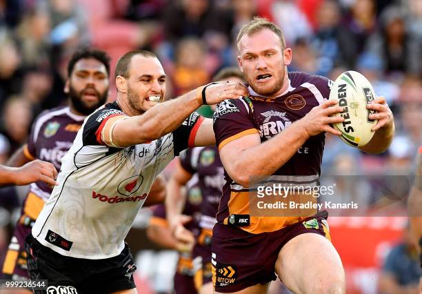 Matthew Lodge of the Broncos attempts to break away from the defence during the round 18 NRL match between the Brisbane Broncos and the New Zealand...