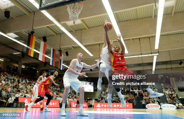 Germany's Maodo Lo and Poland's Adam Waczynski vie for the ball during the basketball Supercup match between Germany and Poland in the edel-optics.de...