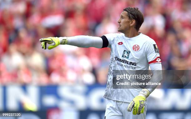 Goalkeeper Rene Adler of Mainz gestures during the German Bundesliga soccer match between FSV Mainz 05 and Hannover 96 in the Opel Arena in Mainz,...