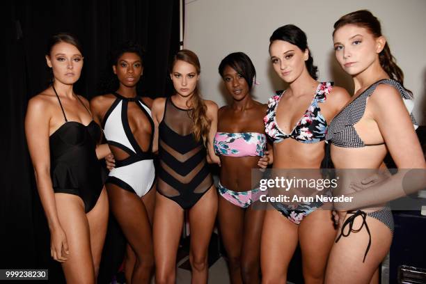 Models pose backstage at Miami Swim Week powered by Art Hearts Fashion Swim/Resort 2018/19 at Faena Forum on July 14, 2018 in Miami Beach, Florida.