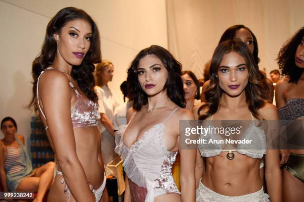 Models pose backstage at Miami Swim Week powered by Art Hearts Fashion Swim/Resort 2018/19 at Faena Forum on July 14, 2018 in Miami Beach, Florida.