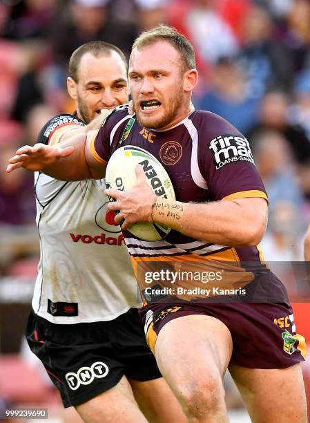 Matthew Lodge of the Broncos takes on the defence during the round 18 NRL match between the Brisbane Broncos and the New Zealand Warriors at Suncorp...