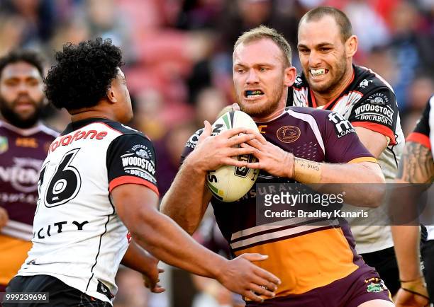 Matthew Lodge of the Broncos takes on the defence during the round 18 NRL match between the Brisbane Broncos and the New Zealand Warriors at Suncorp...
