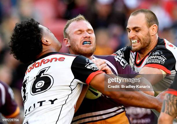 Matthew Lodge of the Broncos takes on the defence during the round 18 NRL match between the Brisbane Broncos and the New Zealand Warriors at Suncorp...